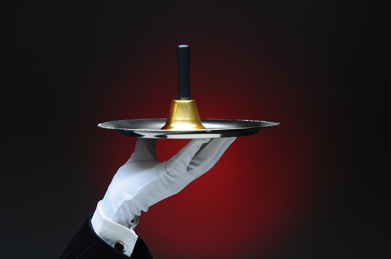 iStock_54458112_LARGE_white_gloved_waiter_with_bell.png