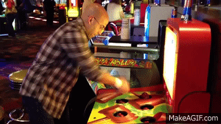 man playing whack-a-mole game
