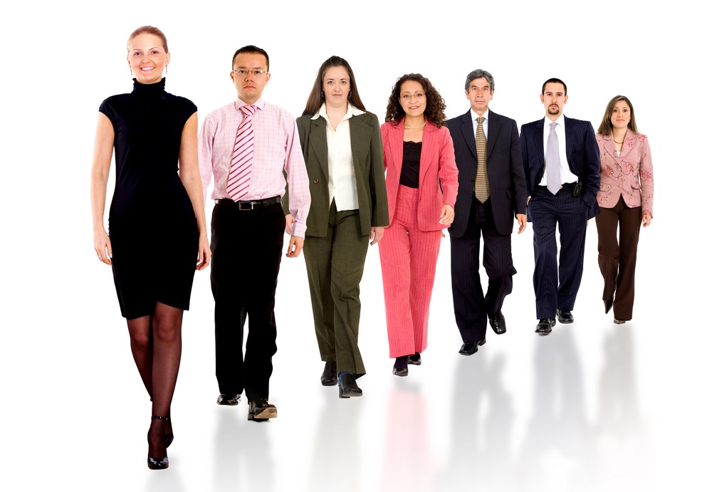 Business team walking forward - leadership and teamwork concepts using a group of businessmen and businesswomen isolated over a white background.jpeg