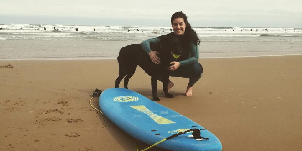 employee spotlight Leti Escanciano on the beach with her dog Samba