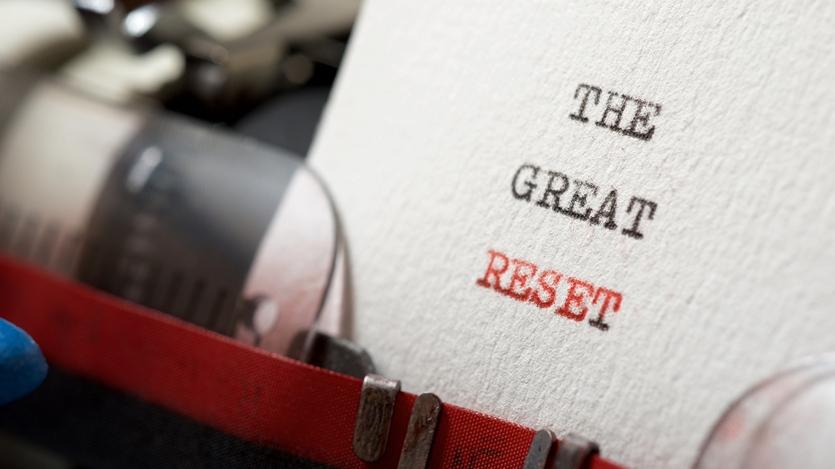 Image of a paper in a typewriter that reads The Great Reset.